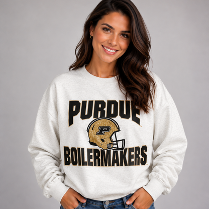 Model wearing the oatmeal heather Purdue Boilermakers Football Drop Shoulder Crewneck with black and gold lettering and a Purdue football helmet graphic.