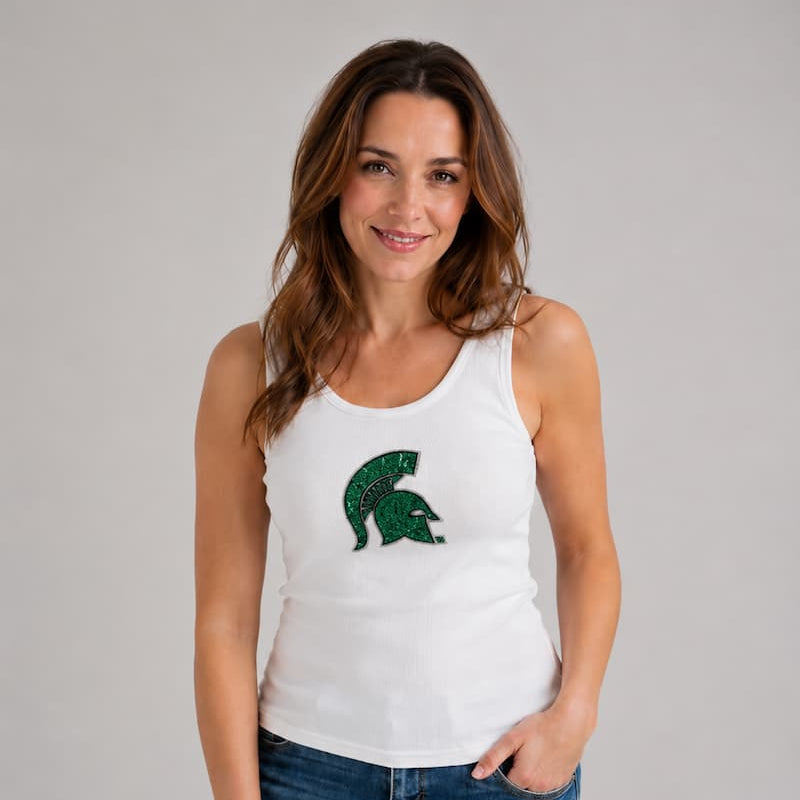 Model wearing the Michigan State Spartans Sequin Ribbed Tank in white, featuring a green sequin Spartan helmet logo centered on the chest.