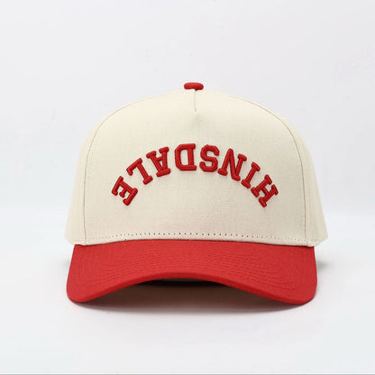 Baseball cap with 'HINSDALE' text on a white background