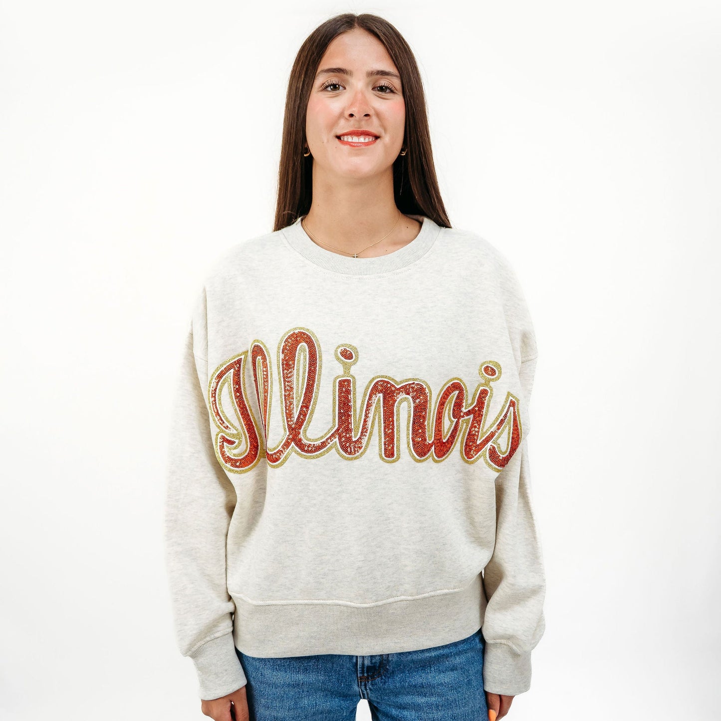 Model wearing the Illinois Fighting Illini Vintage Sequin Slouchy Drop Shoulder Crewneck styled for a boutique game day look.