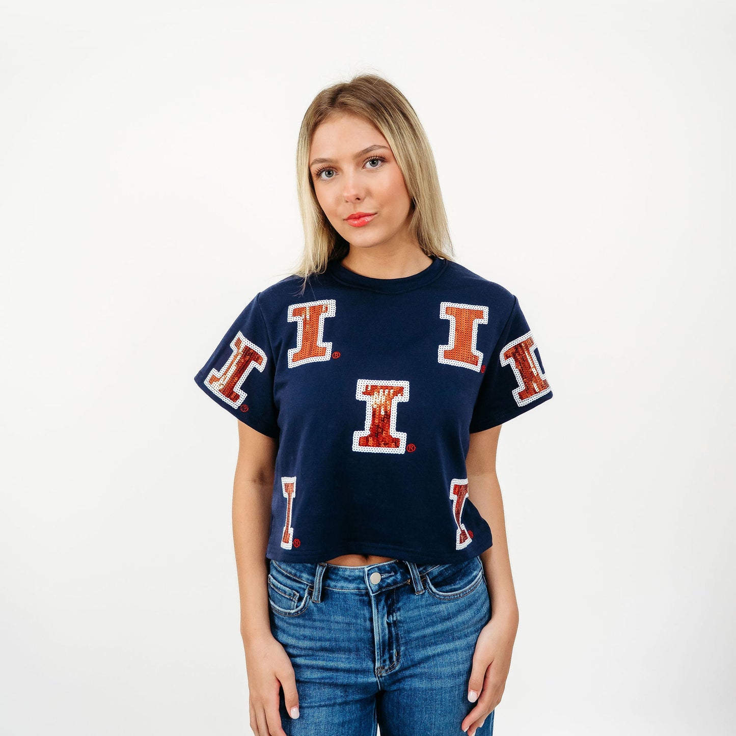 Officially licensed Illinois Fighting Illini Full Coverage Sequin Tee featuring a bold orange and blue sequin Illinois design on a women's game day t-shirt.