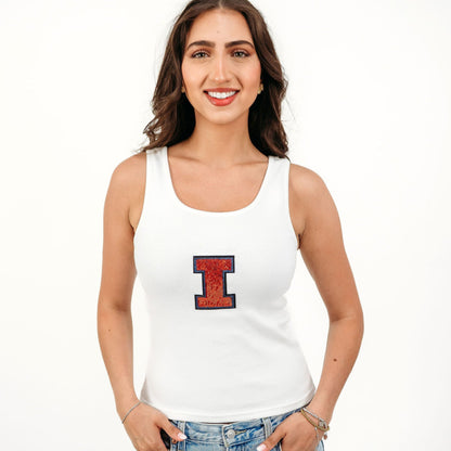 Officially licensed Illinois Fighting Illini women's ribbed tank top featuring a bold sequin Illinois script on a soft, fitted ribbed fabric. A stylish boutique game day top perfect for tailgates, football games, basketball games, and everyday collegiate wear.